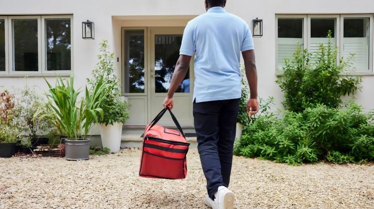 A gig worker delivering a package